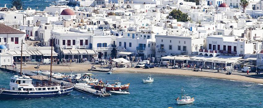 Greece showing boats and white buildings.